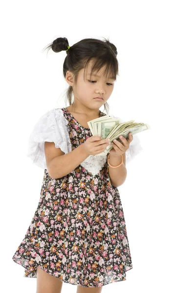 Little girl counting us dollars — Stock Photo, Image