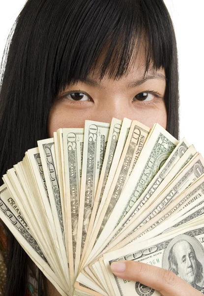 Woman's face behind money — Stock Photo, Image