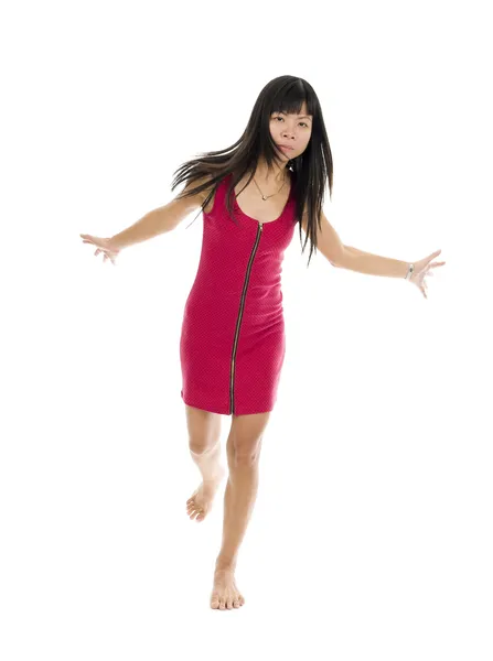 Aziatische vrouw in actie op een been — Stockfoto