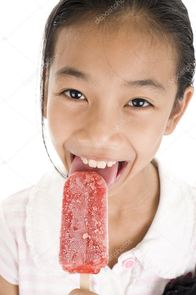 Happy girl licking ice cream