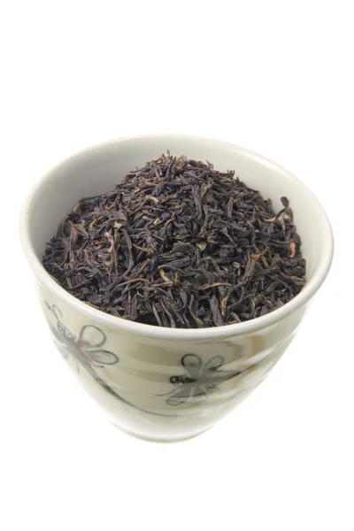 Hojas de té chino en taza —  Fotos de Stock
