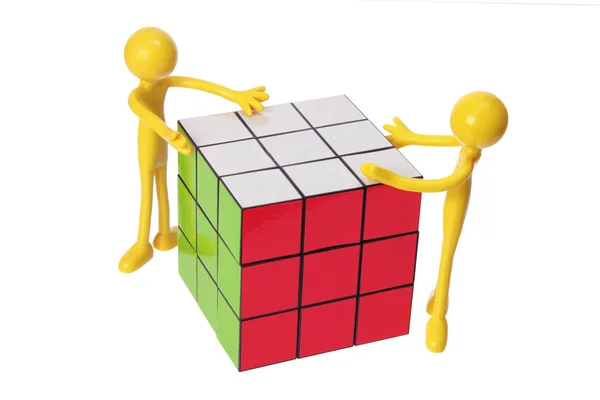 Figuras de borracha e cubo de quebra-cabeça — Fotografia de Stock