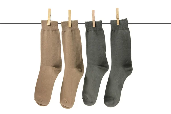 Ponožky zavěšené na šňůře — Stock fotografie