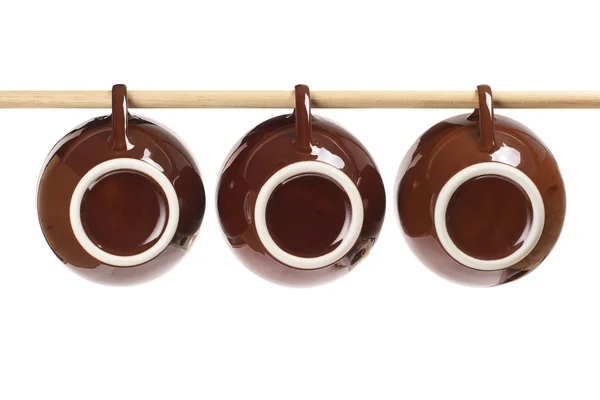 Xícaras de chá penduradas na vara — Fotografia de Stock