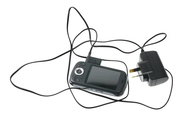 Akıllı telefon ve şarj cihazı — Stok fotoğraf
