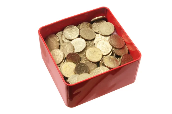 Monedas en caja de lata — Foto de Stock