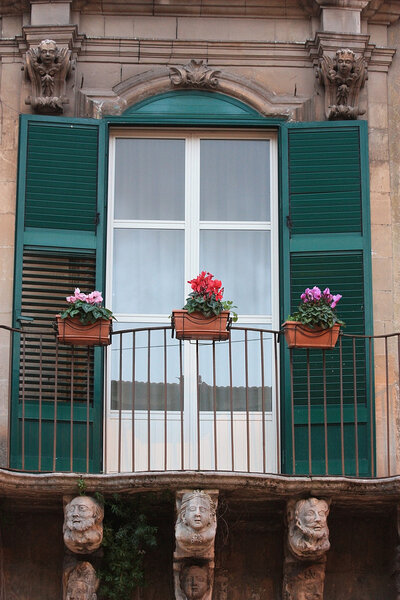 Balcony on the fasade of the old house