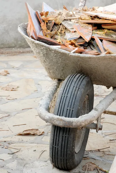 Wheelbarrow with waste — Stock Photo, Image