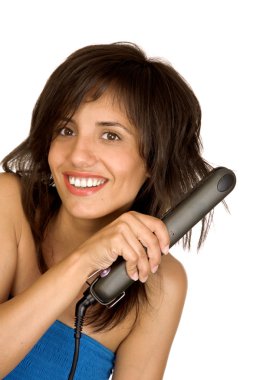 Woman using hair straighteners clipart