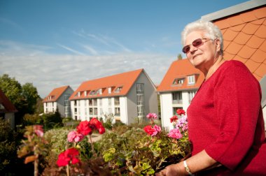 Old woman sunbathes clipart