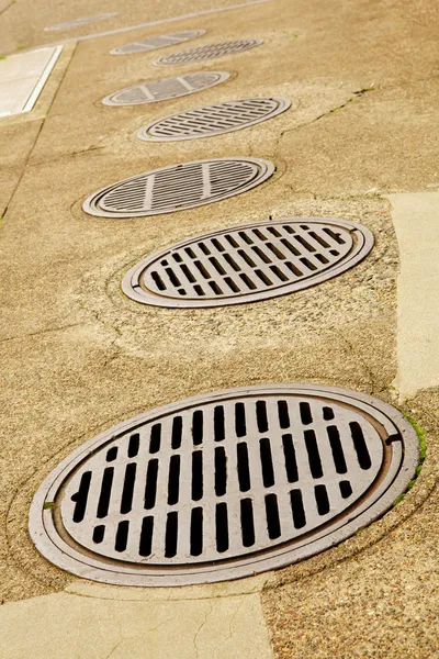 Line up of Sewer Drains — Stock Photo, Image