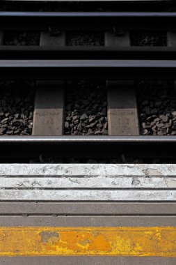 Platform and railway track at London Train station clipart