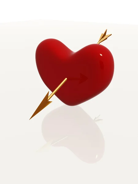 Красное сердце с золотой стрелой — стоковое фото