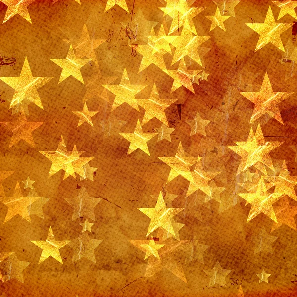 Golden stars over old paper — Stock Photo, Image