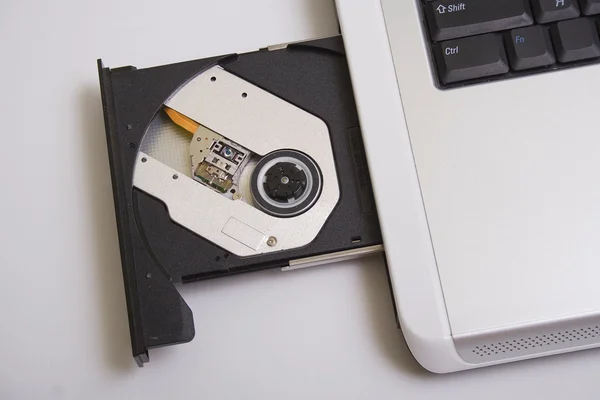 Laptop and the disk — Stock Photo, Image