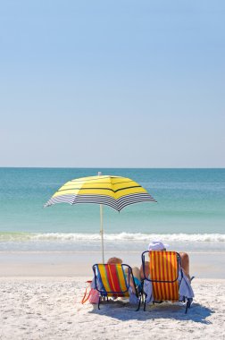 Couple Enjoying the Beach clipart