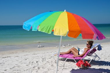 Woman Enjoying The Beach clipart