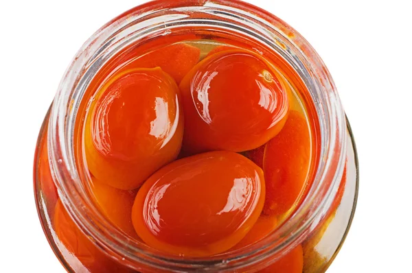 Stock image Red marinated tomatoes in glass the bank