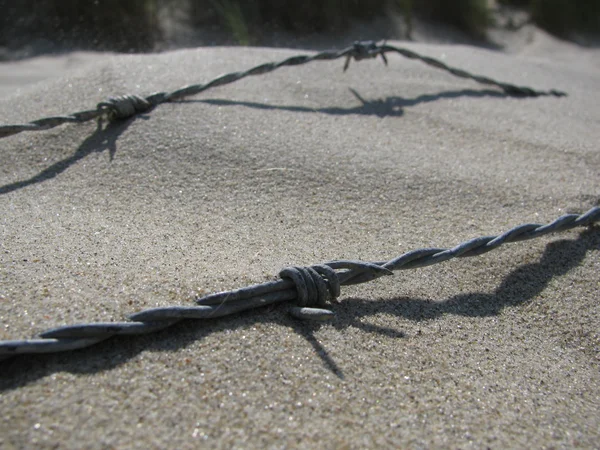 stock image Sand and barbwire