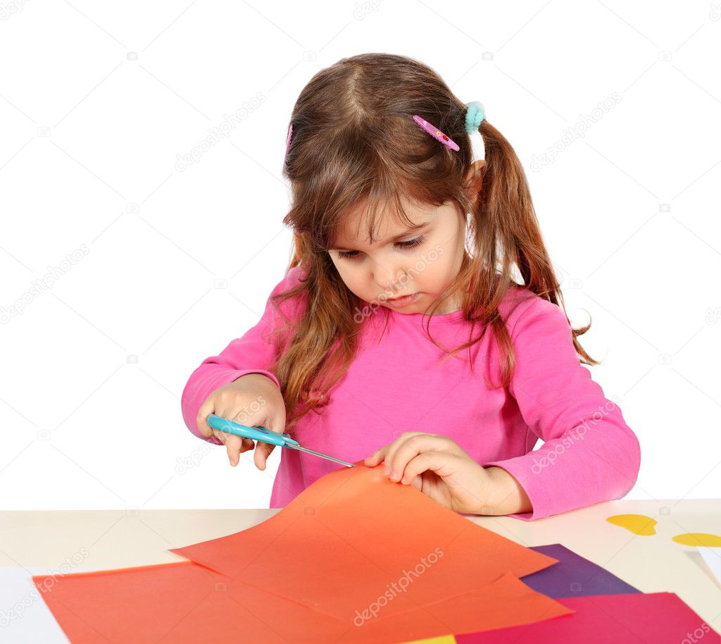 Little Child Girl Making a Cutout