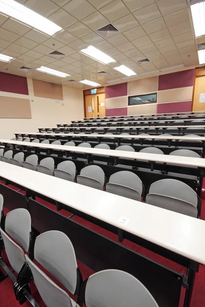 Empty hall for presentation with grey armchairs — Stock Photo, Image