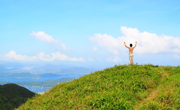 Beautiful mountains landscape with lake in hongkong and man on t — Stock Photo, Image