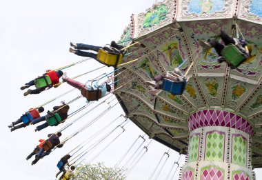 Chain swing ride in amusement park clipart