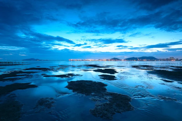 Solnedgång shingle kusten i hong kong — Stockfoto
