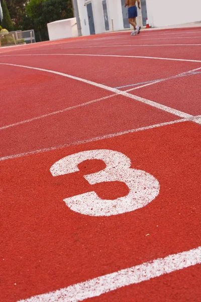 Running track numbers one two three in stadium — Stock Photo, Image