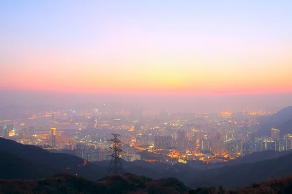 Sunset city in mist — Stock Photo, Image