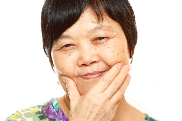 Senior Asian with hand — Stock Photo, Image