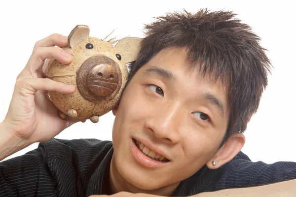 Azië man met piggy bank — Stockfoto