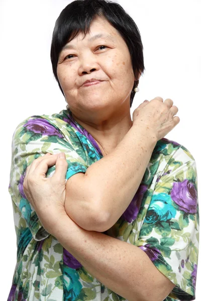 Seniorin macht eine Reihe von Aufwärmübungen — Stockfoto