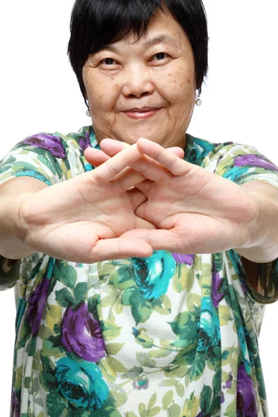 Senior woman doing a series of warm-up exercises — Stock Photo, Image