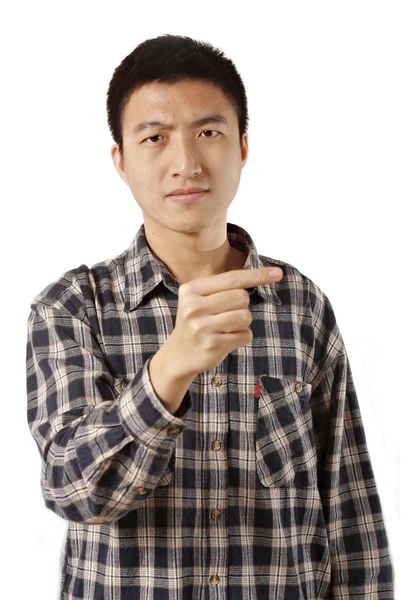 Casual young man pointing left — Stock Photo, Image