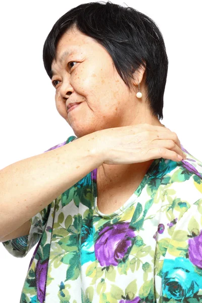 Mujer mayor sosteniendo su dolor de espalda —  Fotos de Stock