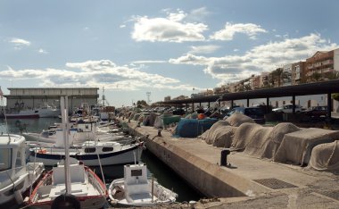 Fishing nets on quay at Garrucha Harbor Marina clipart