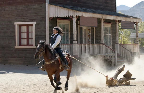 stock image Sheriff dragging a Bandit by rope from his horse