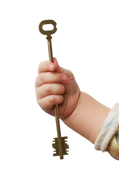 Ruka dítěte s klíčem — Stock fotografie