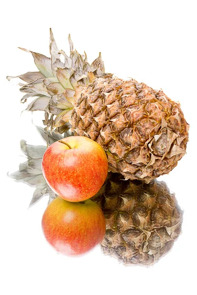 Pineapple and apple with reflection — Stock Photo, Image