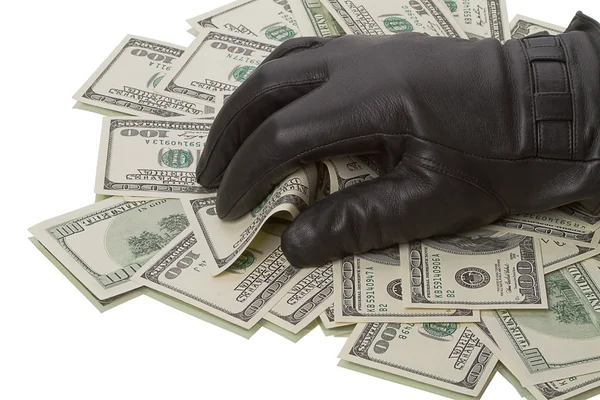 stock image Heap dollars and hand in a black glove