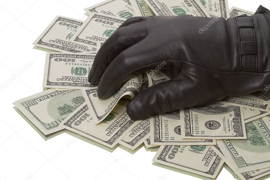 Heap dollars and hand in a black glove