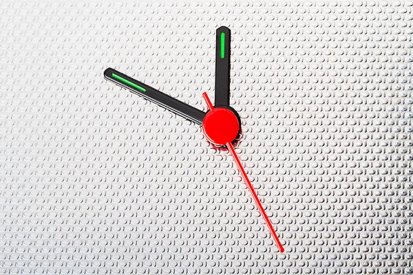 Clock hands on corrugated stainless steel — Stockfoto