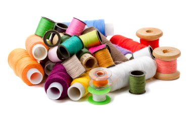 Heap bobbins of sewing threads clipart