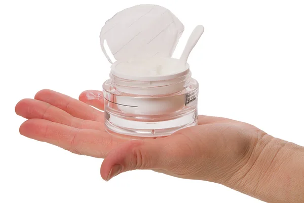 Crema cosmetica su una mano femminile — Foto Stock