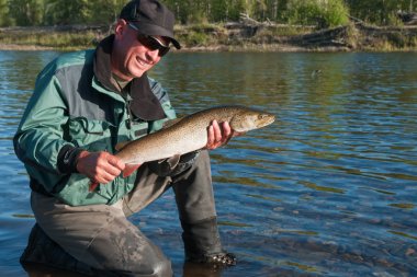 Fisherman with trout fish clipart