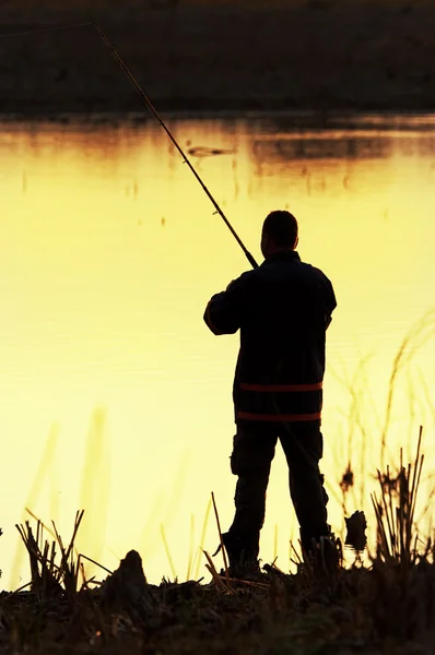 Silhouette da pescatore — Foto Stock