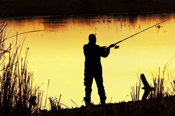 Silhouette da pescatore — Foto Stock