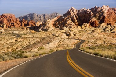 Empty Road through Red Rocks clipart