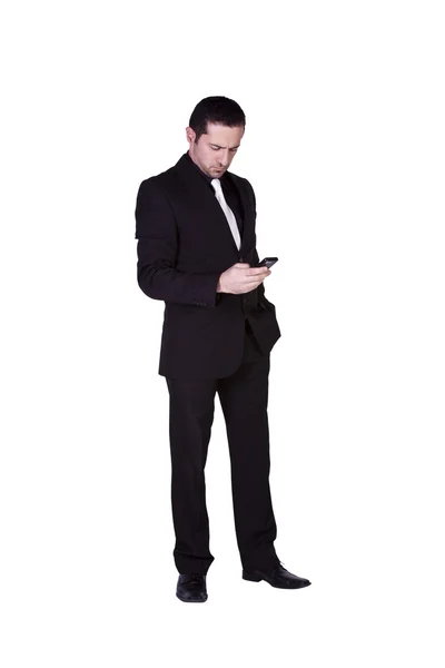 Бизнесмен переписывается по мобильному телефону — стоковое фото